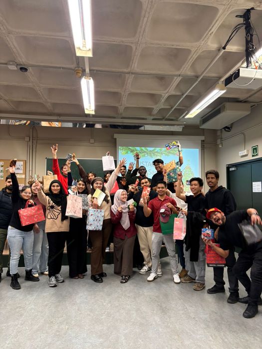 Group celebration after the Secret Santa gift exchange, 2025
