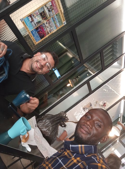 Coffee break with a friend on a balcony, 2026